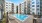 a pool in a courtyard between buildings