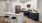 a kitchen with a table and stools