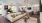 a large room with a large white couch and tables